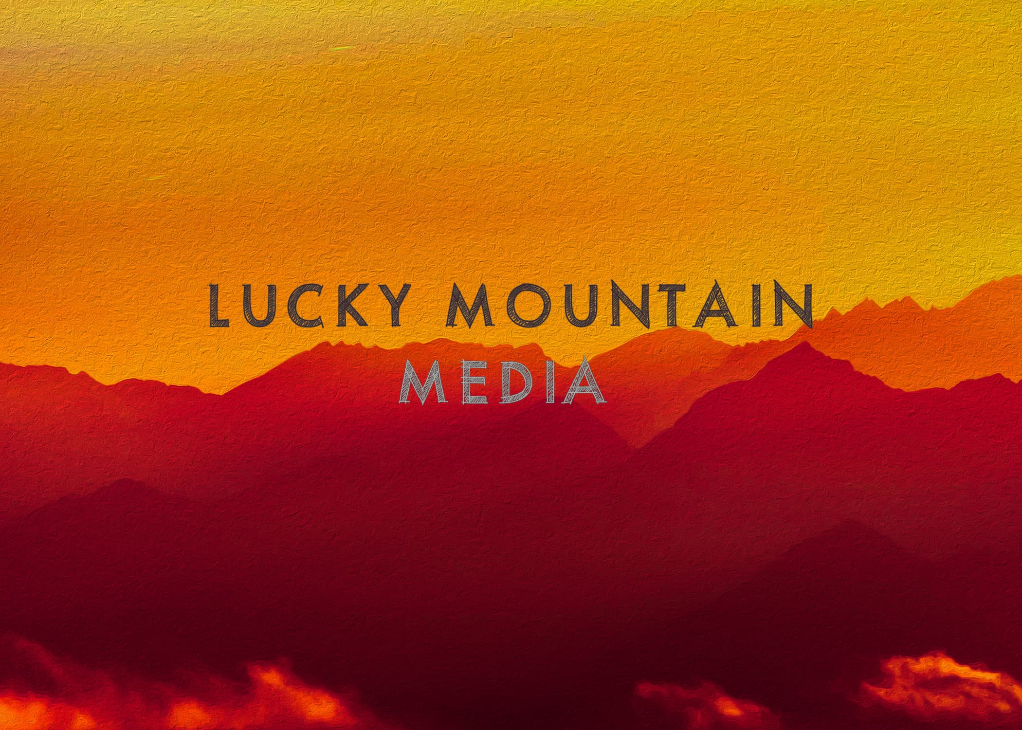 Textured mountain range in warm sunset colors with the text LUCKY MOUNTAIN MEDIA centered.